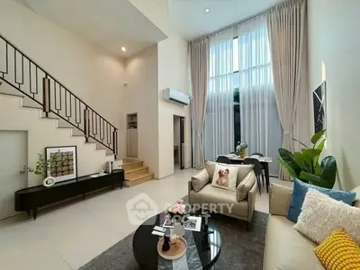 Spacious modern living room with high ceilings and elegant decor