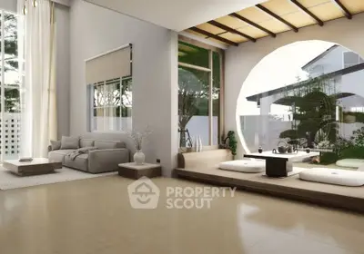 Spacious modern living room with large windows and serene garden view, featuring elegant decor and natural light.