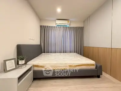 Modern minimalist bedroom with stylish decor and natural light