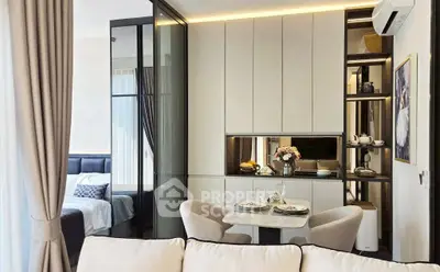 Modern open-plan living room with elegant dining area and cozy bedroom