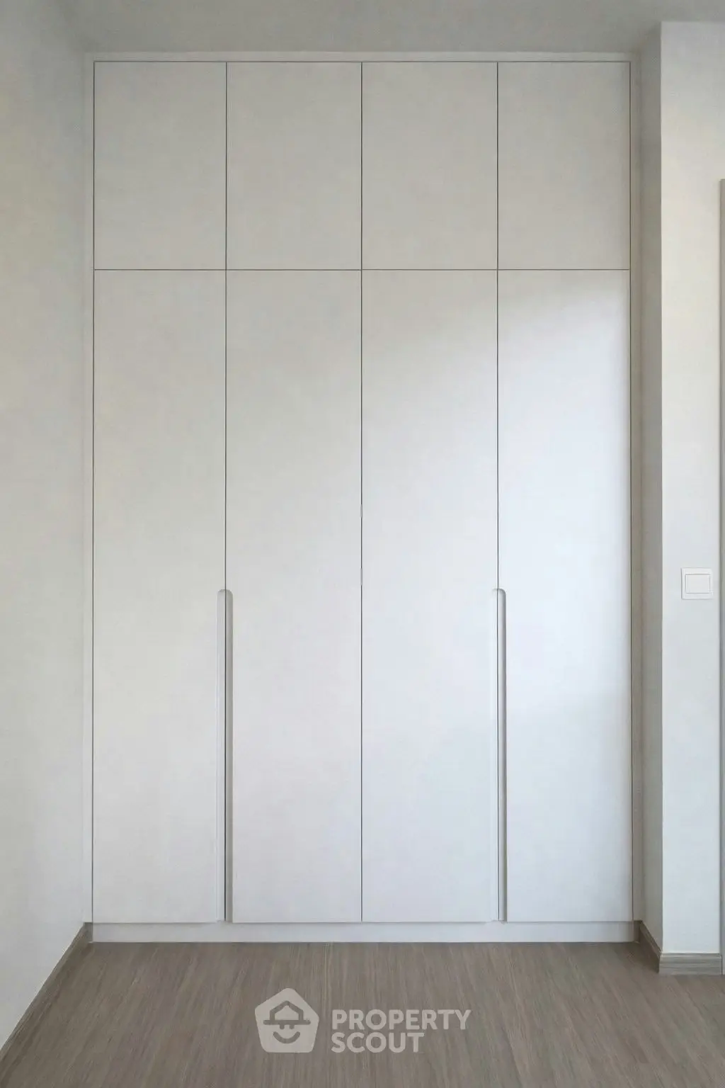Modern built-in wardrobe with sleek design and ample storage space