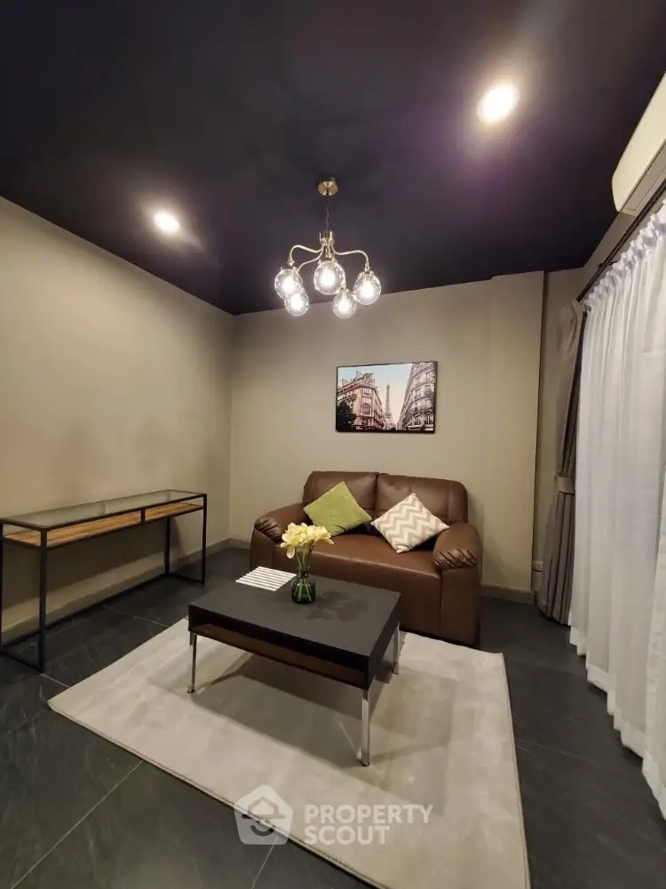 Modern living room with stylish lighting and cozy seating area