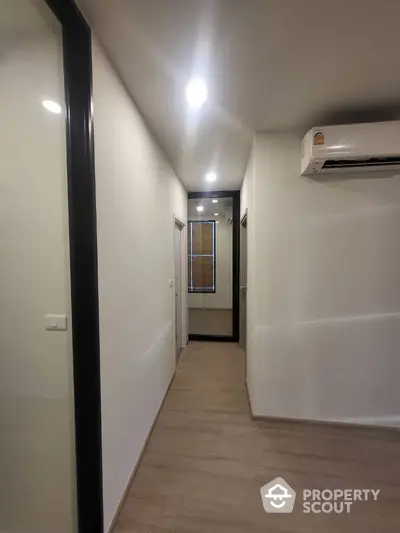 Modern hallway with sleek design and air conditioning unit