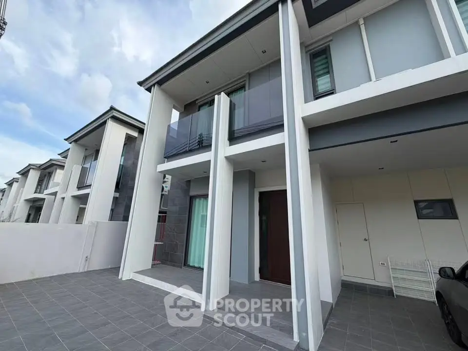 Modern two-story house with sleek design and spacious balcony