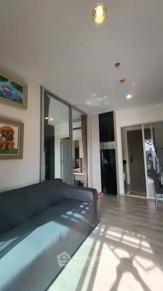 Modern living room with sleek design and ample natural light