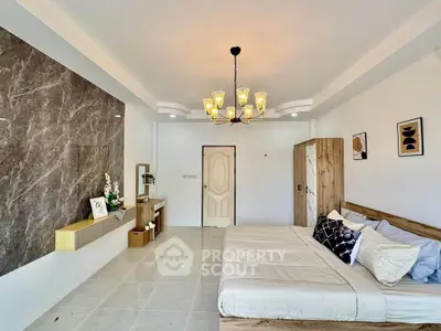 Spacious modern bedroom with elegant decor and stylish lighting