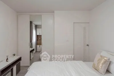 Modern minimalist bedroom with white decor and built-in wardrobe