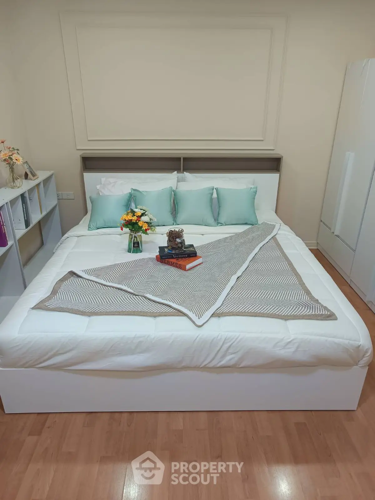 Cozy bedroom with elegant decor and stylish bedding, perfect for relaxation and comfort.