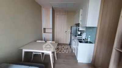 Modern compact kitchen with dining area in a cozy apartment