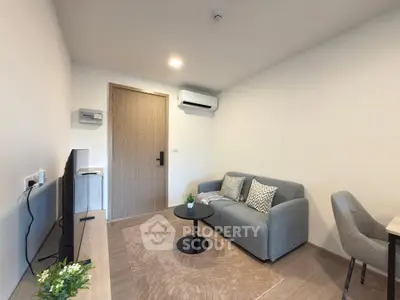 Modern living room with cozy sofa and sleek decor in a stylish apartment.