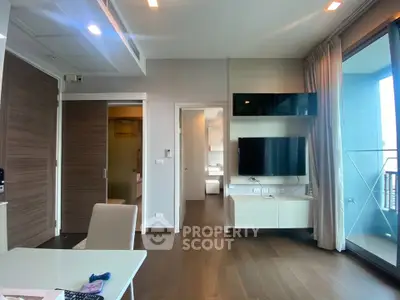 Modern living room with sleek design and balcony view