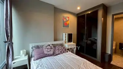 Modern bedroom with stylish decor and ample natural light