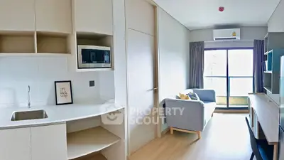 Modern apartment interior with open kitchen and cozy living area