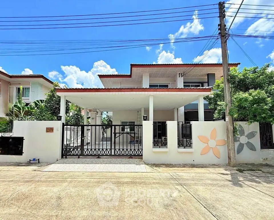 Charming two-story house with spacious driveway and modern exterior design, perfect for family living.