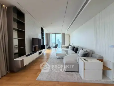 Luxurious modern living room with panoramic city view, elegant furniture, and sleek design.