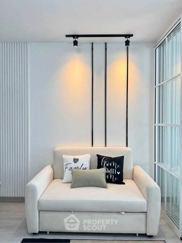 Modern living room with cozy sofa and stylish decor