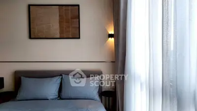 Modern bedroom with stylish decor and natural light