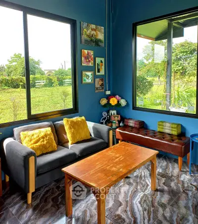 Charming living room with garden view, cozy seating, and stylish decor in a modern home.