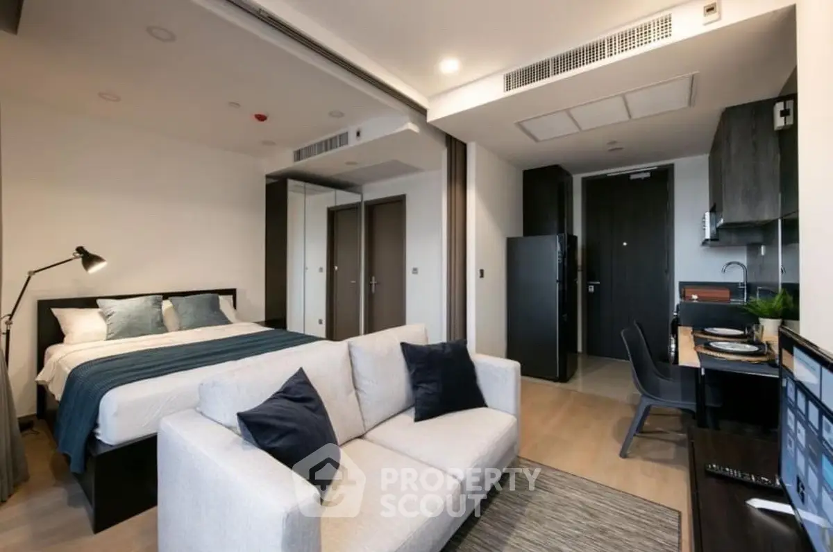 Modern studio apartment with cozy living area and stylish decor