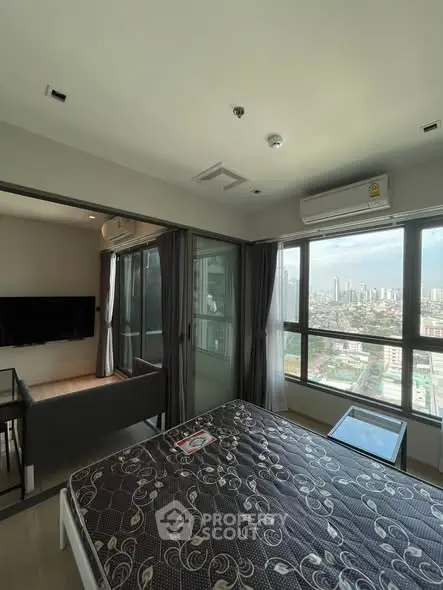 Modern high-rise apartment with panoramic city views and stylish interior design.