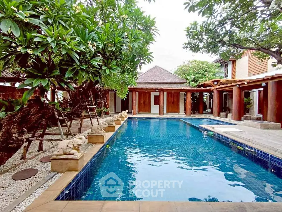 Luxurious villa with private pool and lush garden, perfect for relaxation and entertaining.