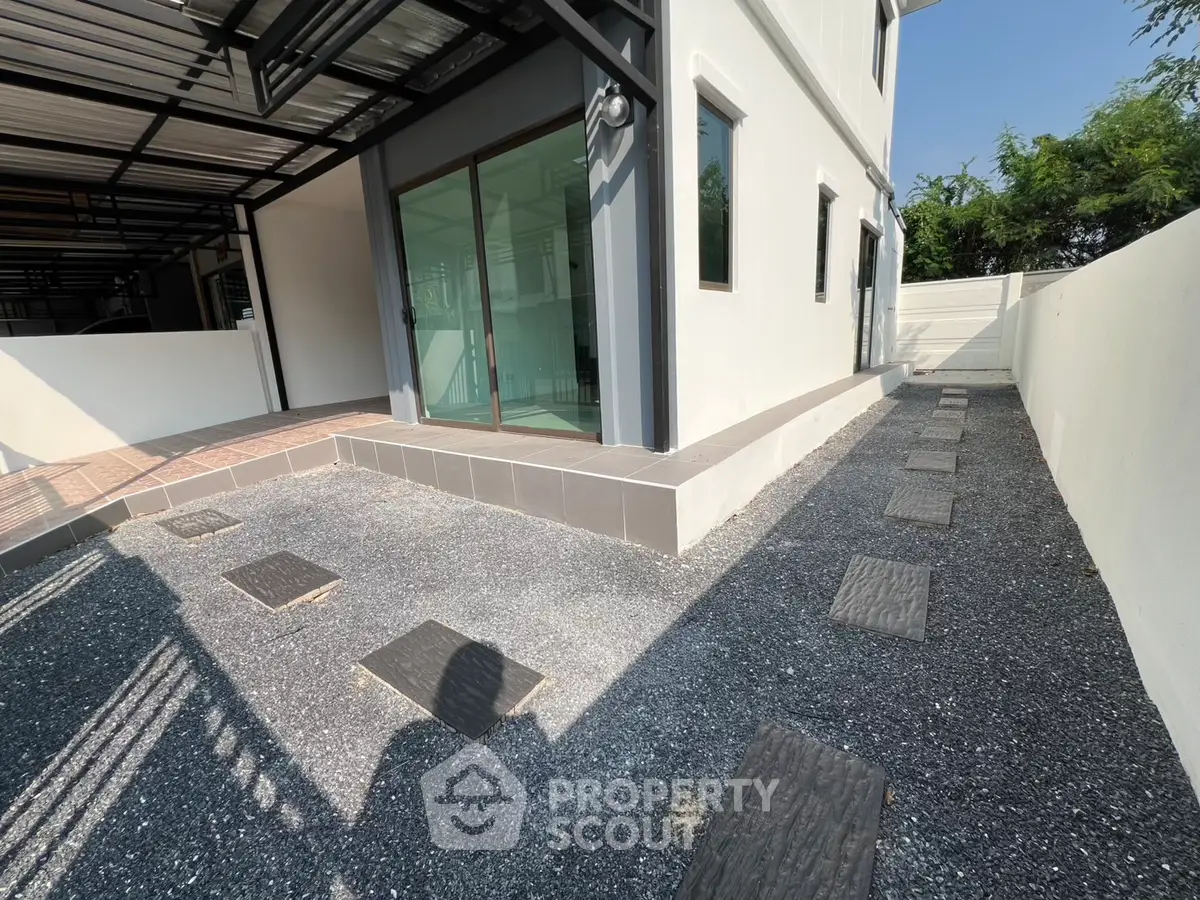 Modern exterior with sleek design and spacious patio area