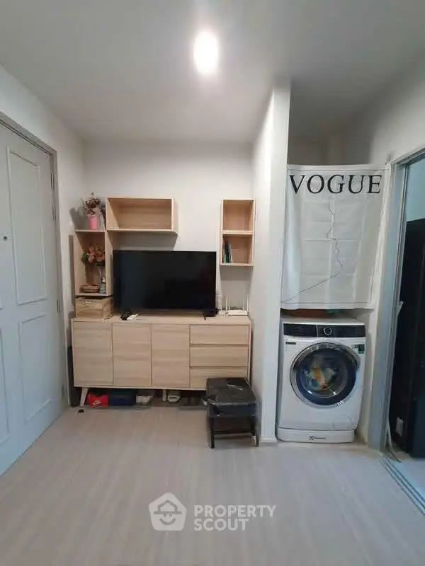 Modern living room with washing machine and stylish decor