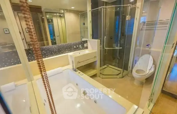 Luxurious bathroom with jacuzzi and modern shower in upscale apartment