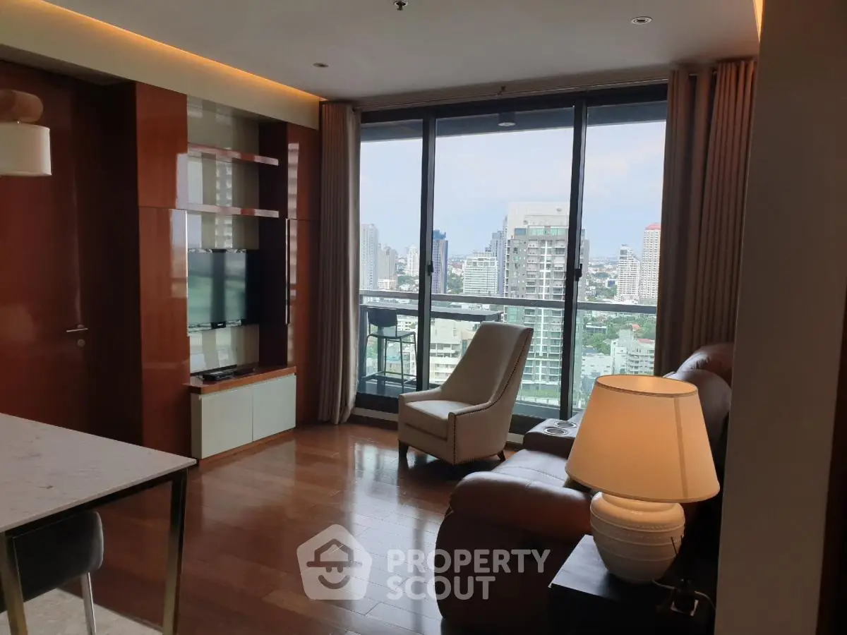 Luxurious living room with city view and modern furnishings in high-rise apartment