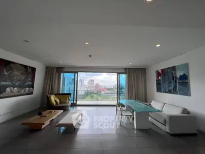 Spacious modern living room with stunning city view and elegant decor