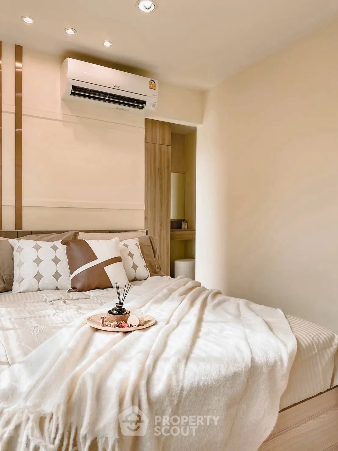 Cozy bedroom with modern decor and air conditioning unit