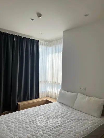 Cozy bedroom with natural light and modern furnishings