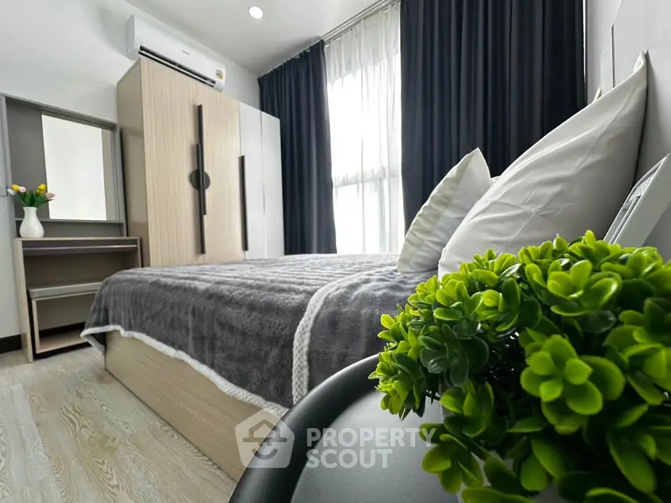 Modern bedroom with stylish decor and natural light