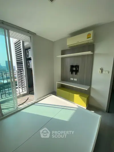 Modern apartment with balcony and air conditioning, featuring a sleek interior design and city view.