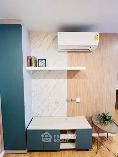 Modern living room with air conditioning and stylish shelving
