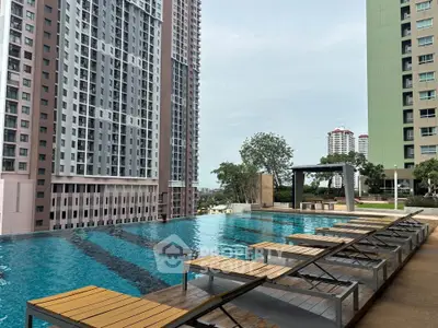 Luxurious high-rise apartment with stunning pool and city views, perfect for urban living.