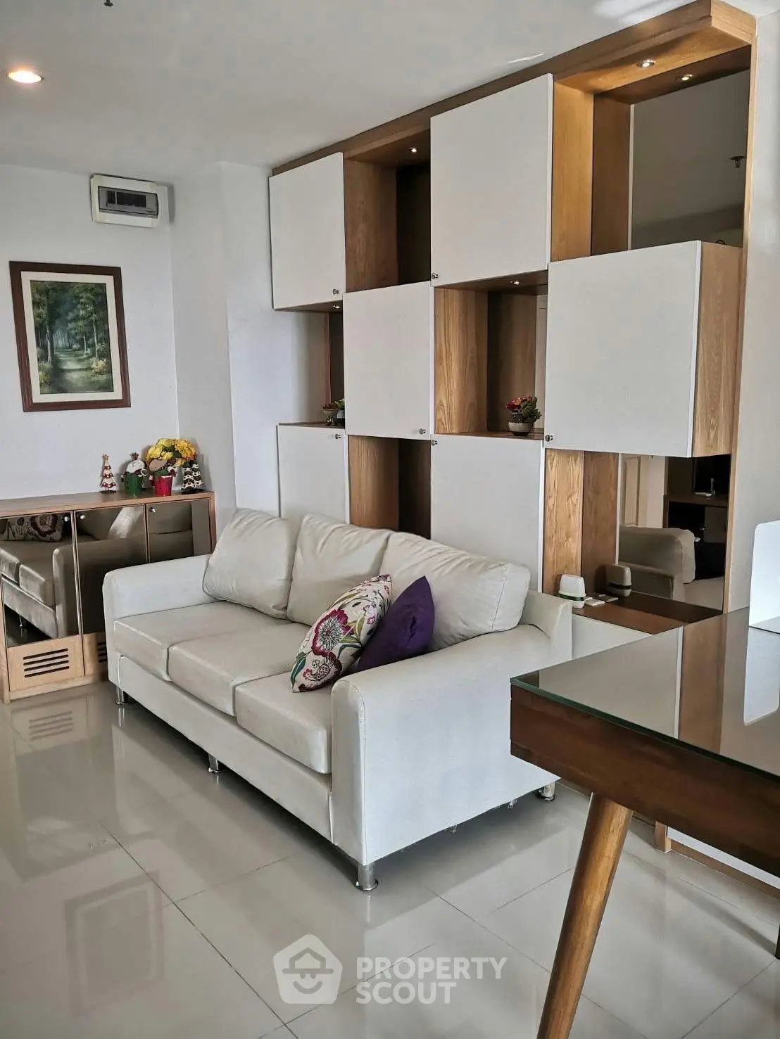 Modern living room with stylish shelving and comfortable sofa in a contemporary apartment.