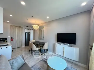 Modern living room with elegant dining area and wall-mounted TV in a stylish apartment.