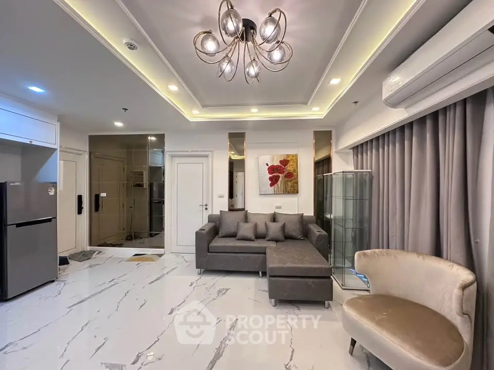 Luxurious modern living room with elegant lighting and stylish furniture in a contemporary apartment.