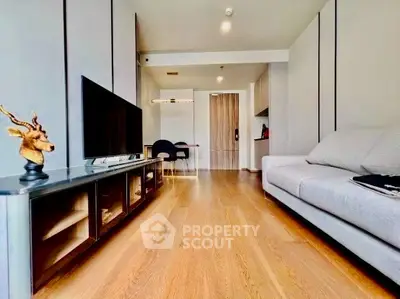 Modern living room with sleek design, hardwood floors, and stylish furniture in a contemporary apartment.