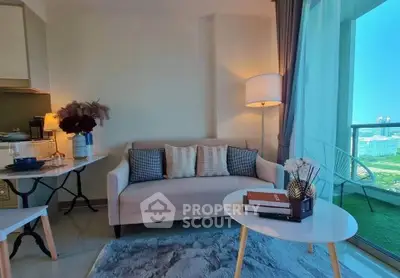 Chic living room with cozy sofa and balcony view in modern apartment