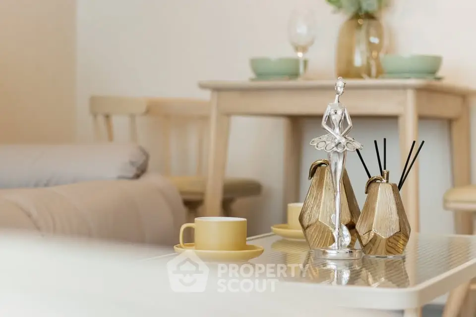 Chic living room with elegant decor and cozy dining setup, perfect for modern living.