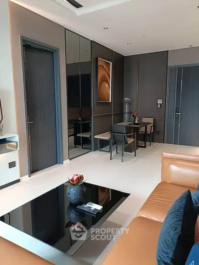 Modern living room with sleek furniture and stylish decor in a contemporary apartment.