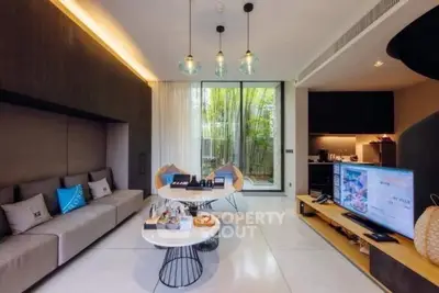 Modern living room with stylish decor and open kitchen layout