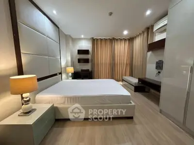 Spacious modern bedroom with elegant lighting and stylish decor