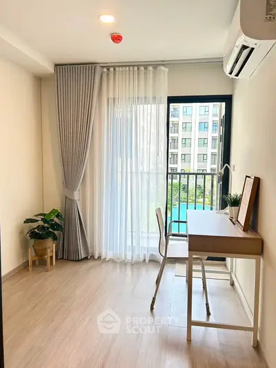 Bright study room with balcony view in modern apartment