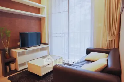 Cozy modern living room with large window and stylish furniture