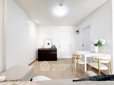 Bright and modern living room with minimalist decor and dining area