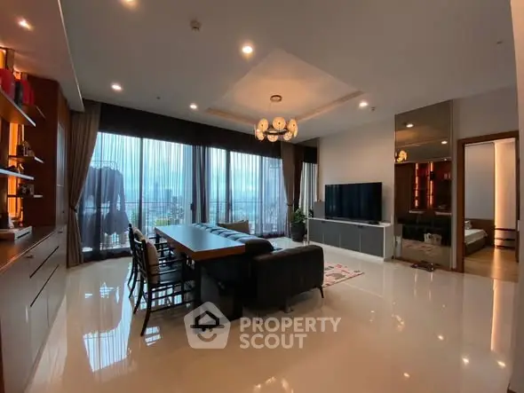 Spacious modern living room with large windows and city view, perfect for urban living.