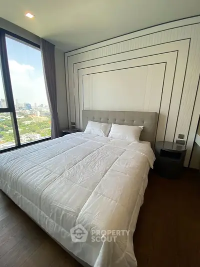 Luxurious bedroom with stunning city view and modern decor